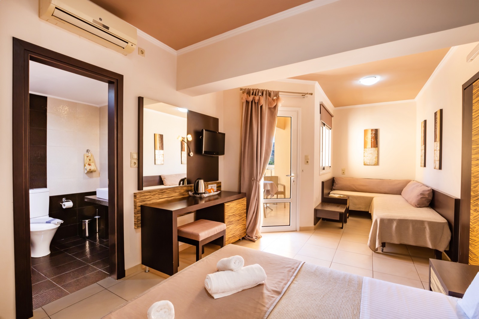 Family room with double bed and sofa area